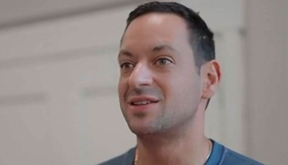 Physiotherapist looking being interviewed about his work